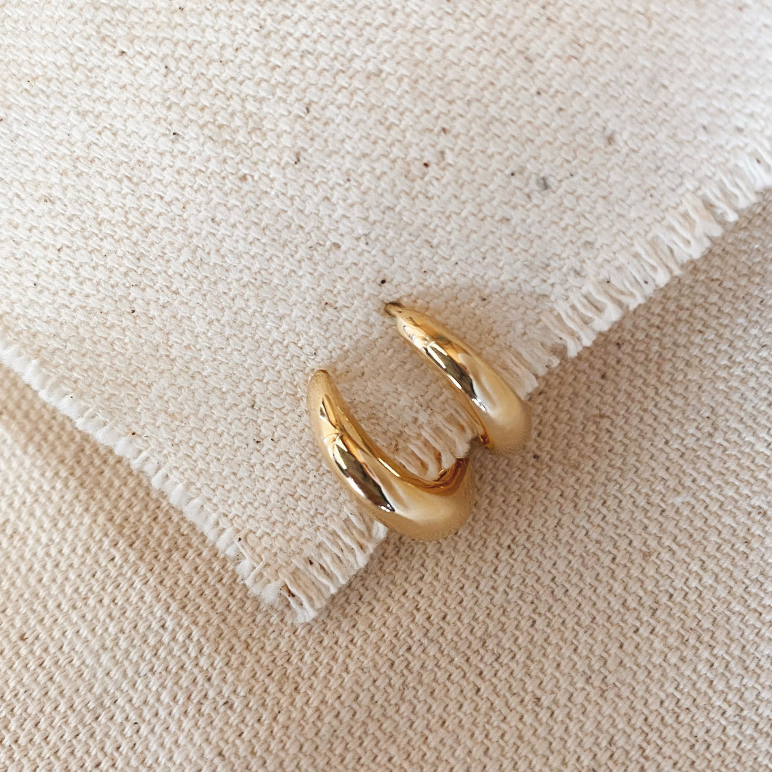 18k gold-filled clicker hoop earrings with a hinged back, an example of earring closures built for comfort