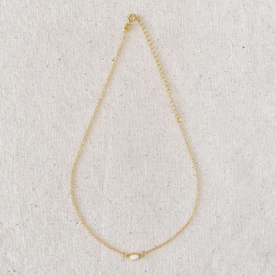 18k Gold Vermeil Opal Necklace next to 18k gold-filled pieces, illustrating the difference between vermeil and gold-fill
