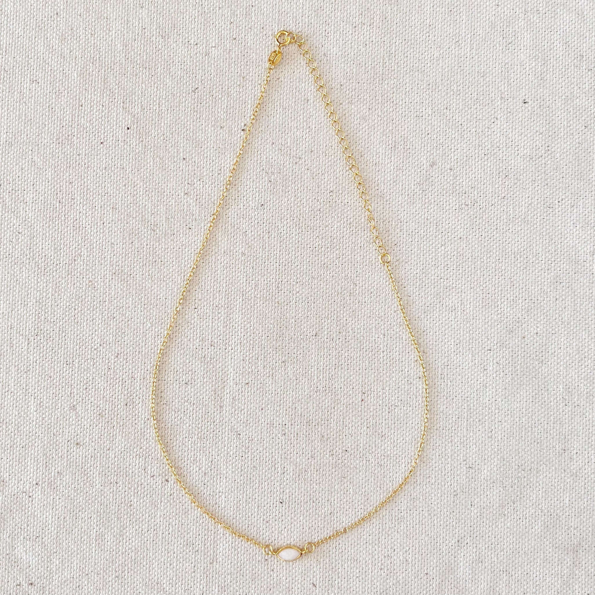 18k Gold Vermeil Opal Necklace next to 18k gold-filled pieces, illustrating the difference between vermeil and gold-fill